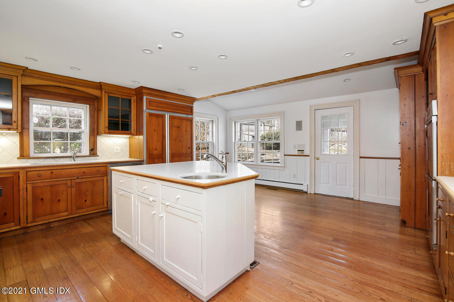 187 Stanwich Road Greenwich, CT 06830 - Photo 14 of 31 a large kitchen with a window and wooden floor