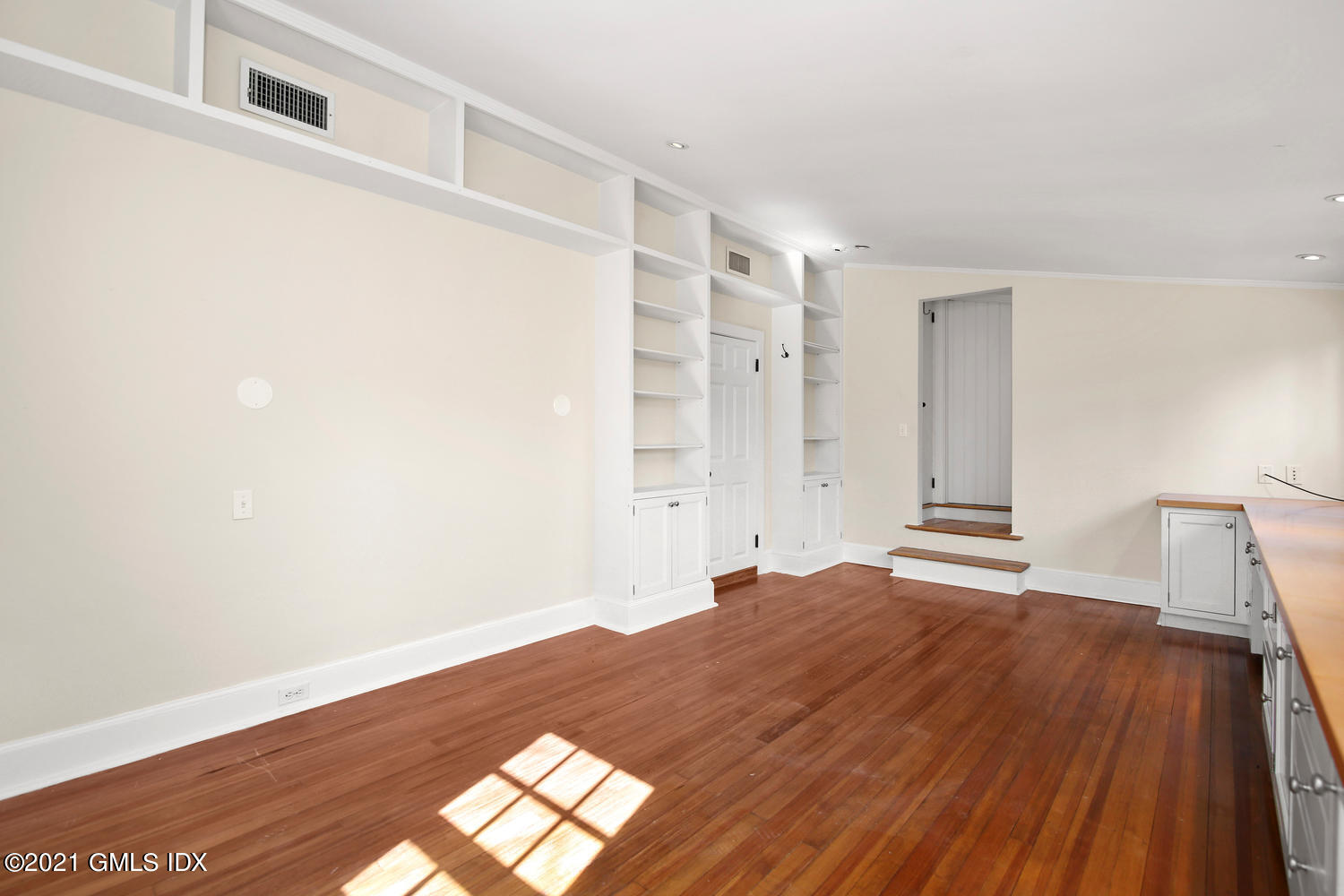 187 Stanwich Road Greenwich, CT 06830 - Photo 19 of 31 a view of empty room with wooden floor and fan