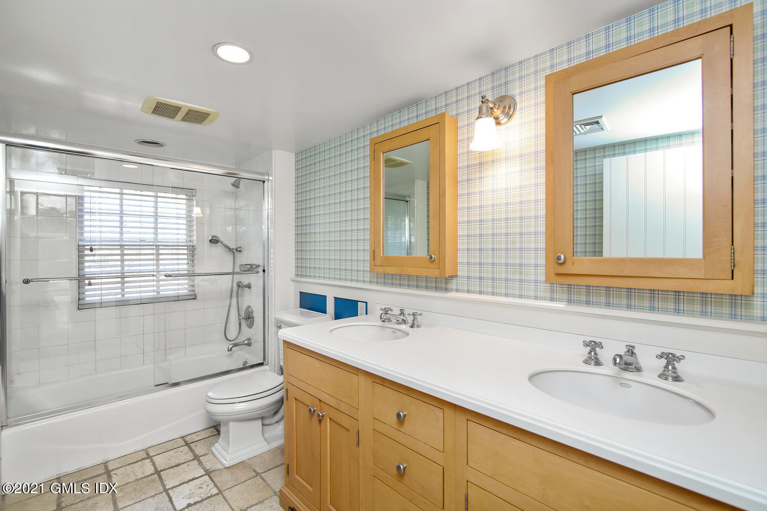 187 Stanwich Road Greenwich, CT 06830 - Photo 20 of 31 a bathroom with a granite countertop sink toilet and shower