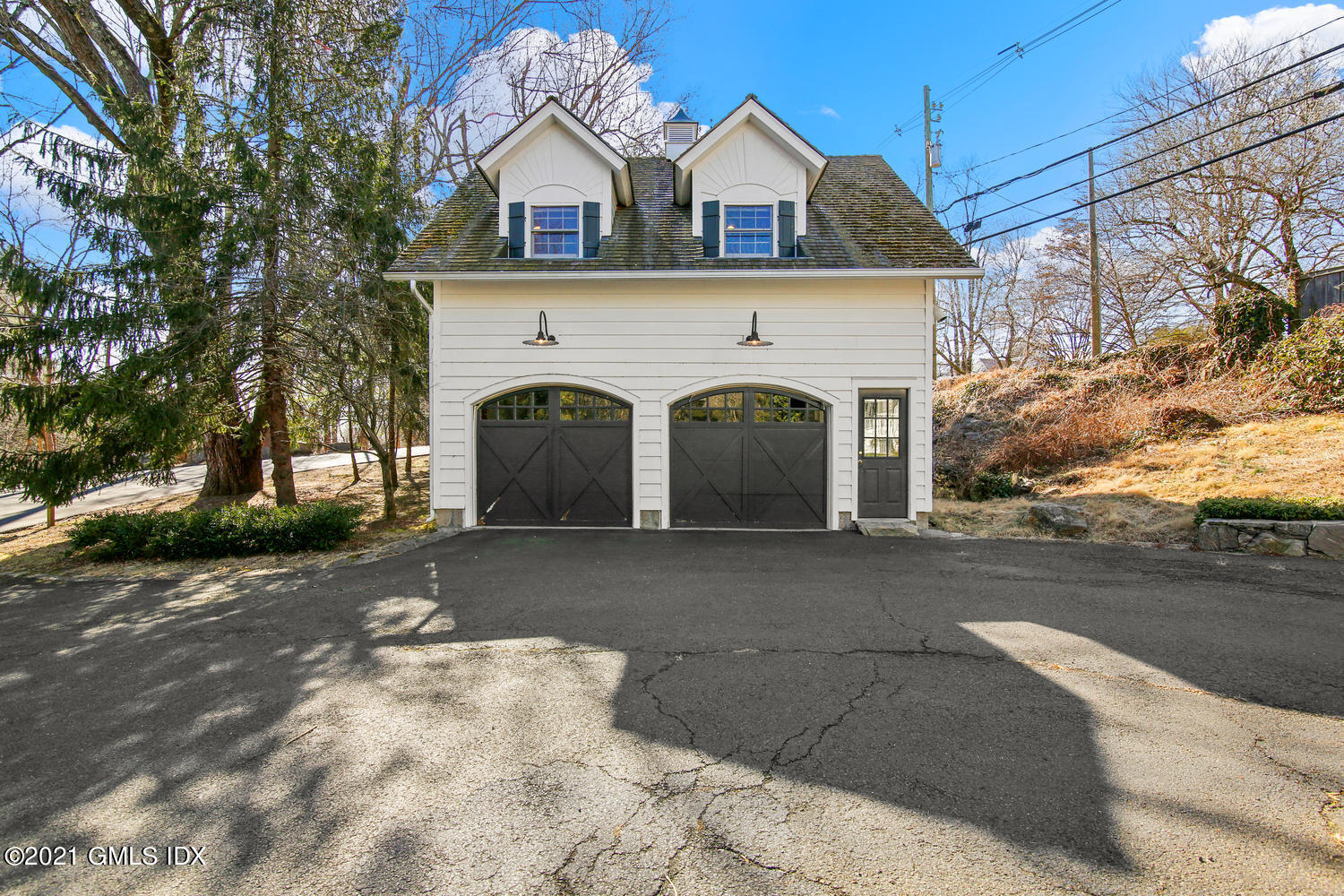 187 Stanwich Road Greenwich, CT 06830 - Photo 27 of 31 a view of a grey house with a road