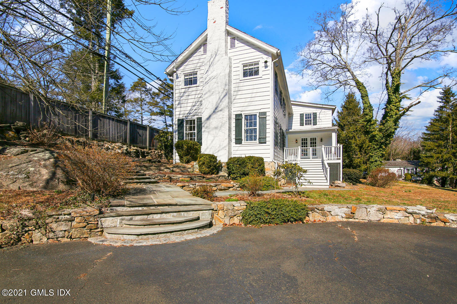 187 Stanwich Road Greenwich, CT 06830 - Photo 3 of 31 a view of a white house with a large windows next to a building