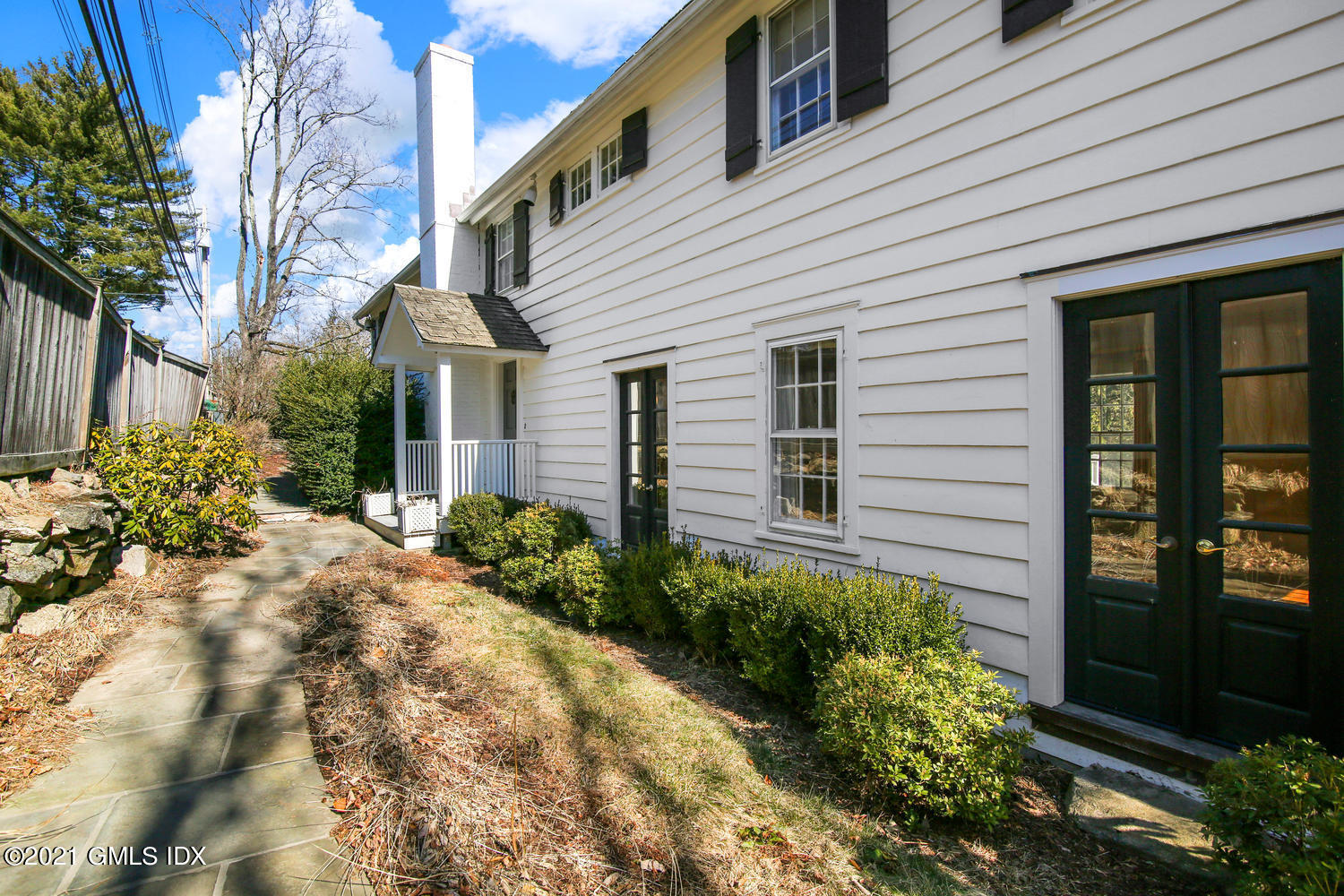 187 Stanwich Road Greenwich, CT 06830 - Photo 4 of 31 a view of a house with brick walls and potted plants