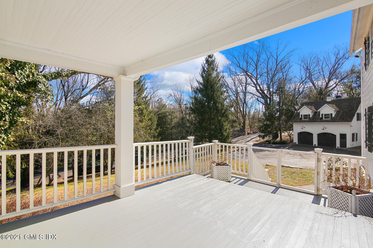 187 Stanwich Road Greenwich, CT 06830 - Photo 5 of 31 a view of a house with a wooden fence