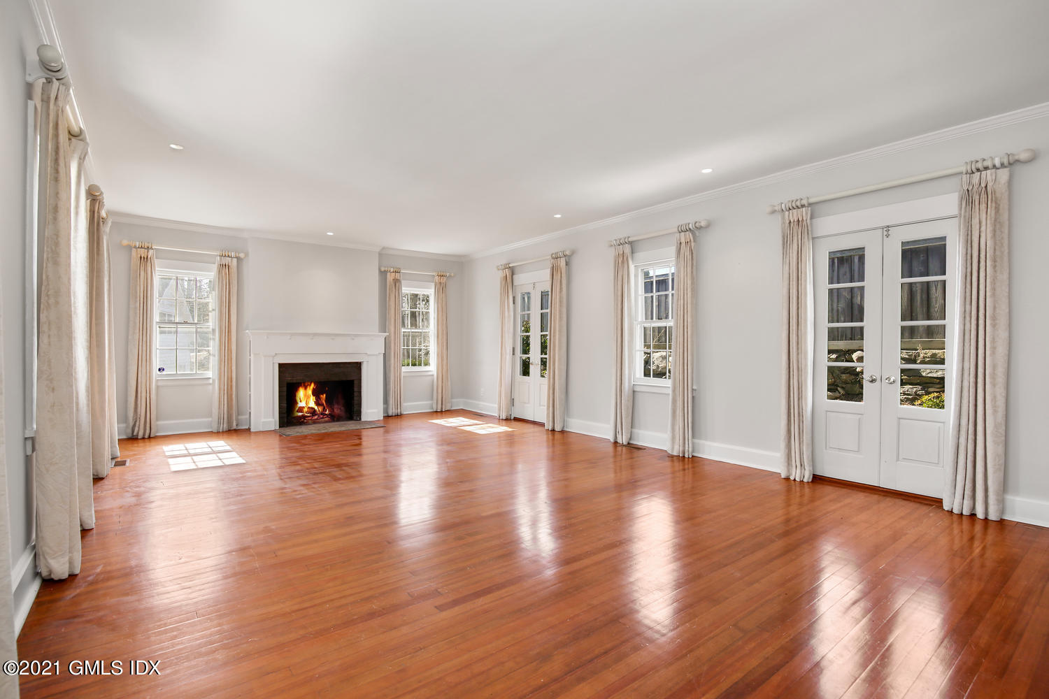 187 Stanwich Road Greenwich, CT 06830 - Photo 7 of 31 a view of an empty room with wooden floor and a window