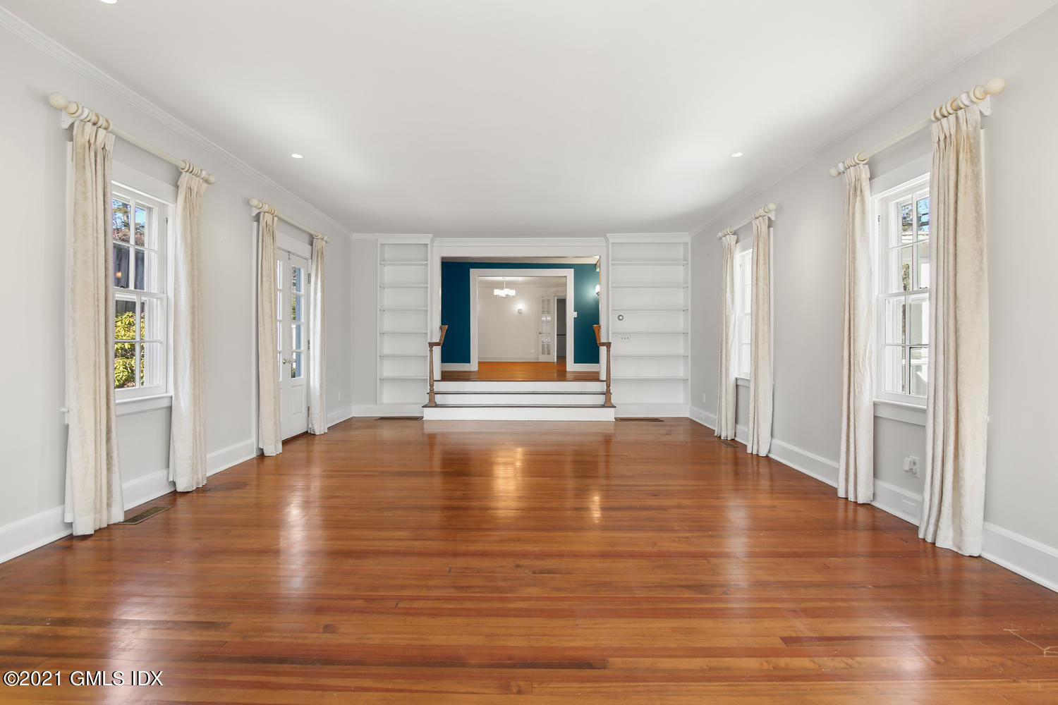 187 Stanwich Road Greenwich, CT 06830 - Photo 8 of 31 a view of empty room with wooden floor and fan