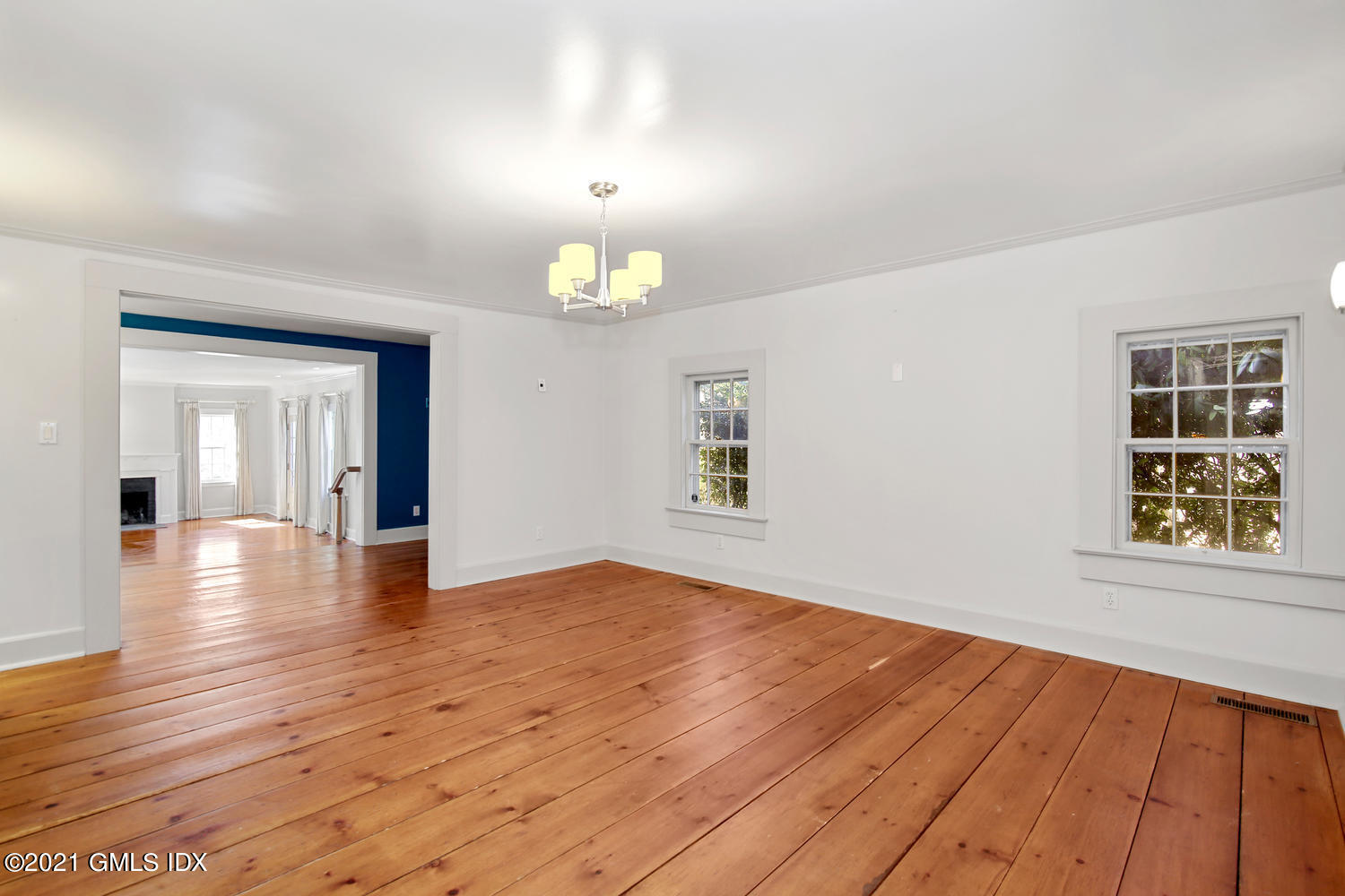 187 Stanwich Road Greenwich, CT 06830 - Photo 10 of 31 wooden floor in an empty room with a window