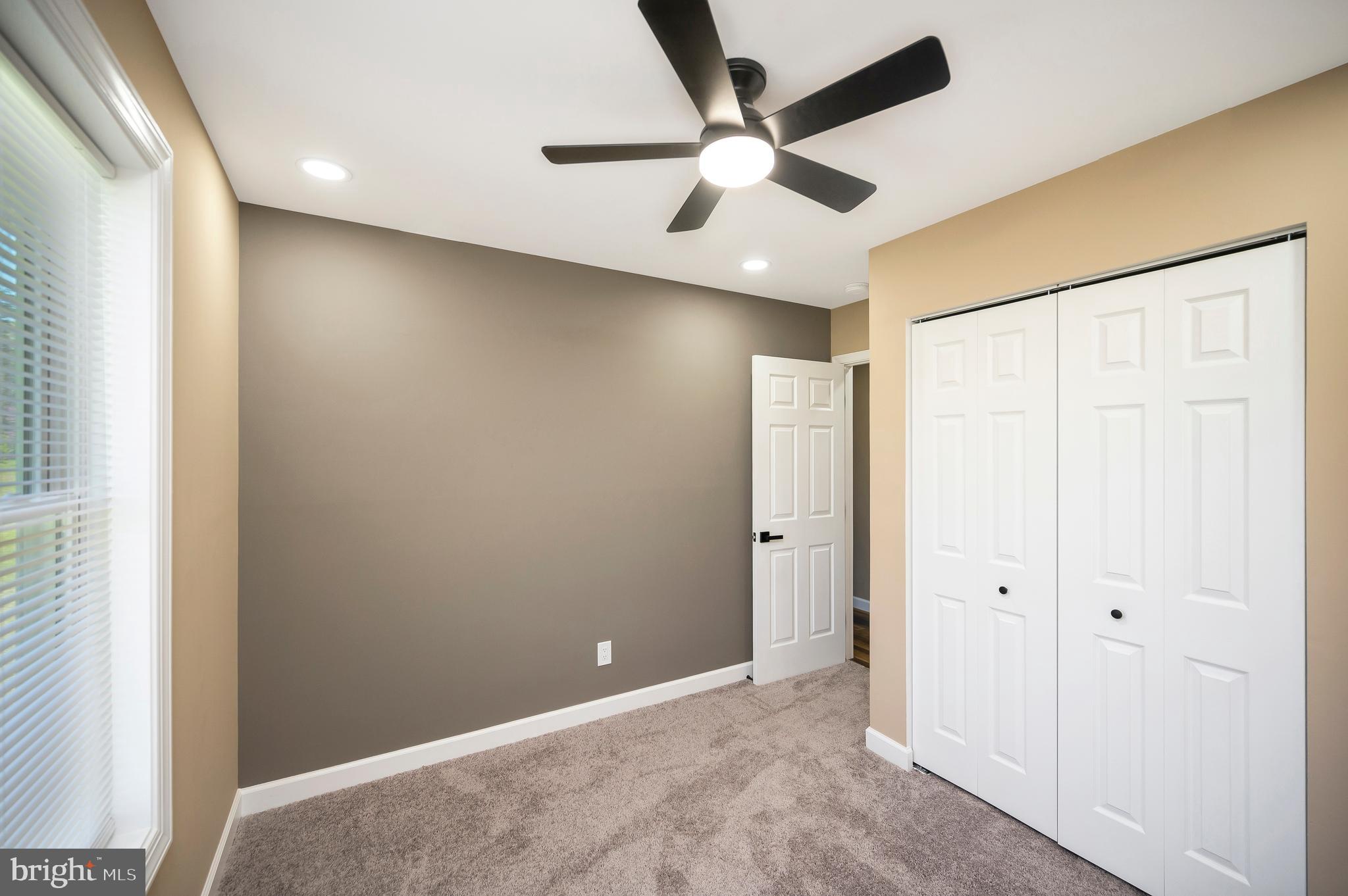 13452 Post Oak Road Spotsylvania, VA 22551 - Photo 40 of 56 an empty room with a ceiling fan and a window