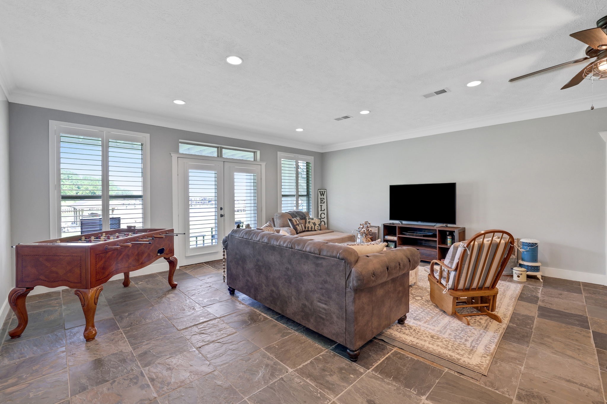 231 Ridge Cove Lane Coldspring, TX 77331 - Photo 33 of 50 The game room leads out to another covered patio
