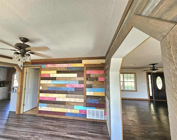 a kitchen with granite countertop a stove and a refrigerator