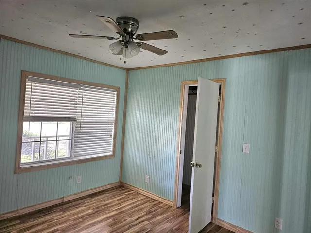 a kitchen with a stove a sink and a microwave