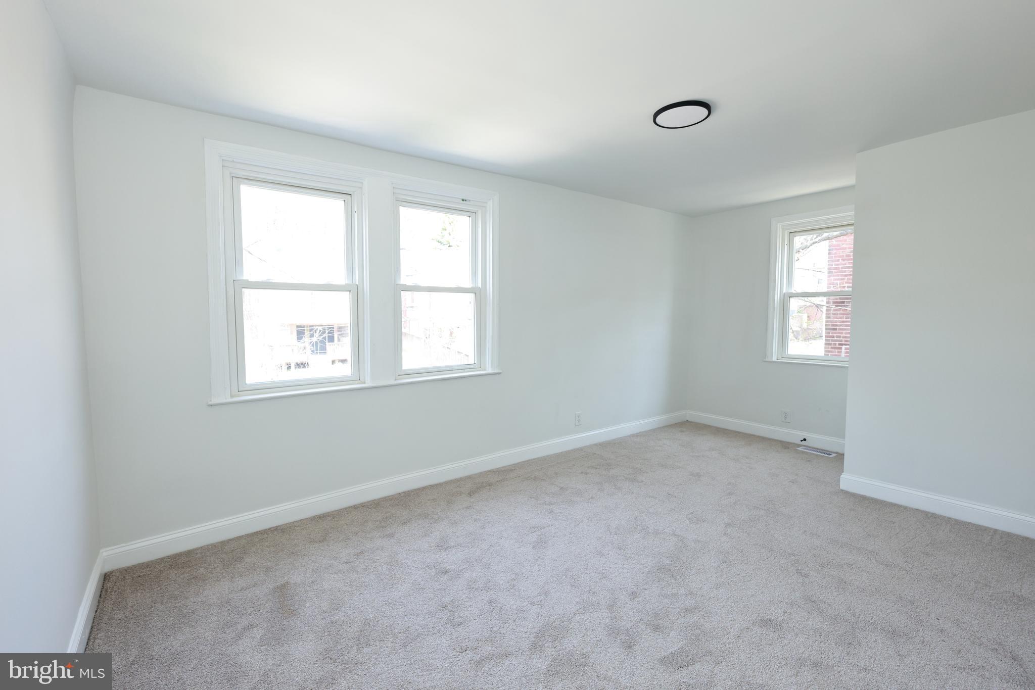 4220 Frederick Avenue Baltimore, MD 21229 - Photo 13 of 24 an empty room with windows