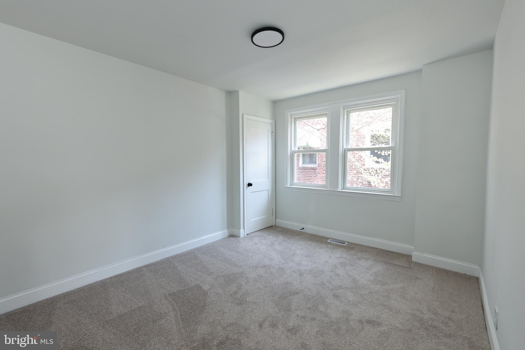 4220 Frederick Avenue Baltimore, MD 21229 - Photo 15 of 24 an empty room with windows