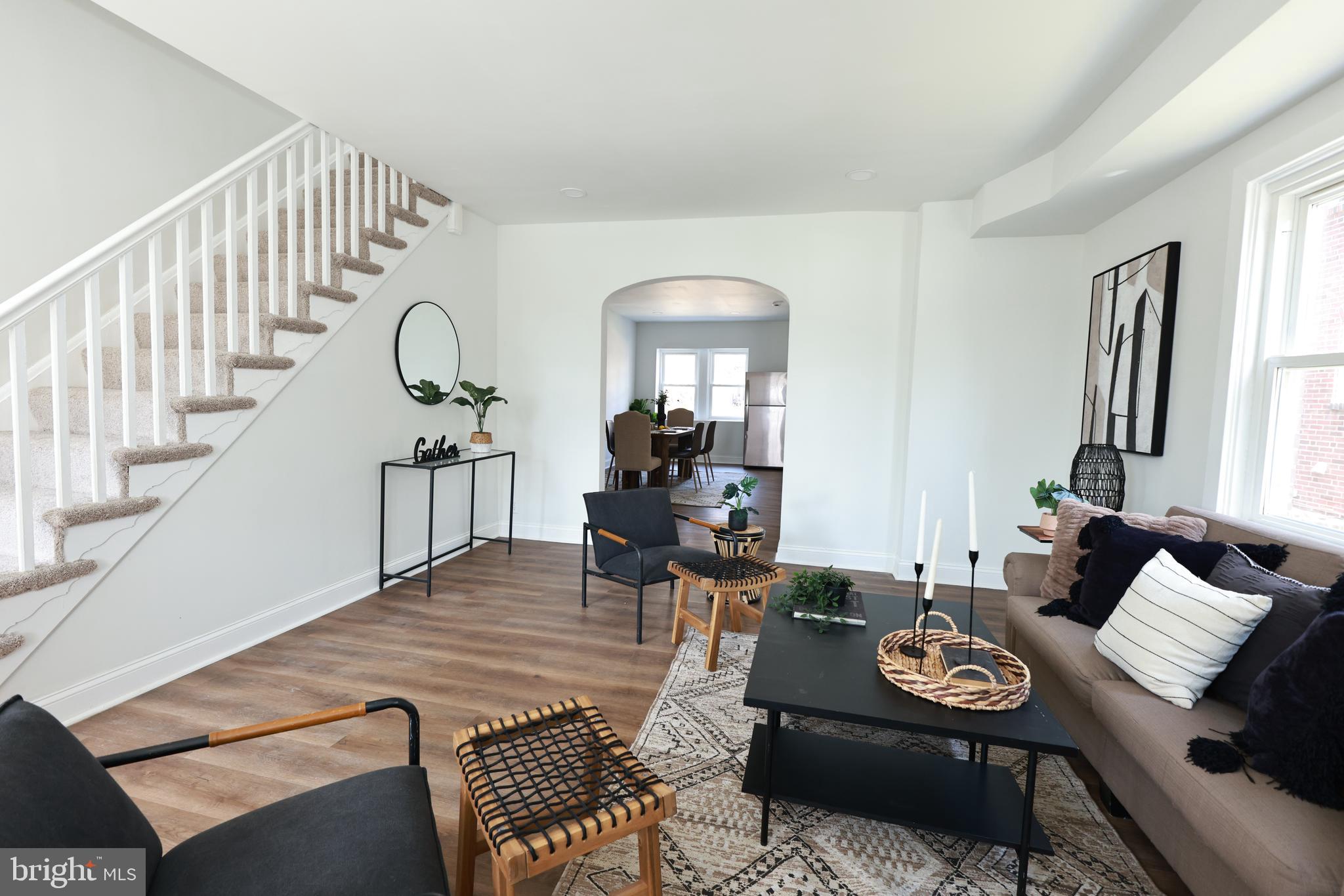 4220 Frederick Avenue Baltimore, MD 21229 - Photo 2 of 24 a living room with furniture and wooden floor