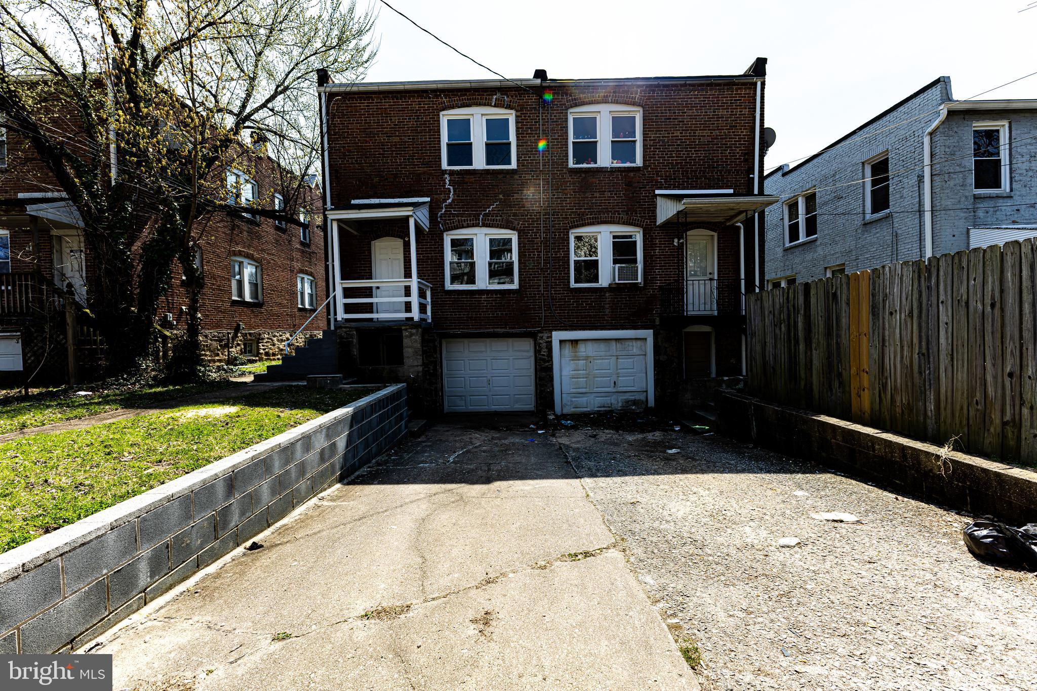 4220 Frederick Avenue Baltimore, MD 21229 - Photo 24 of 24 a front view of a house with a yard