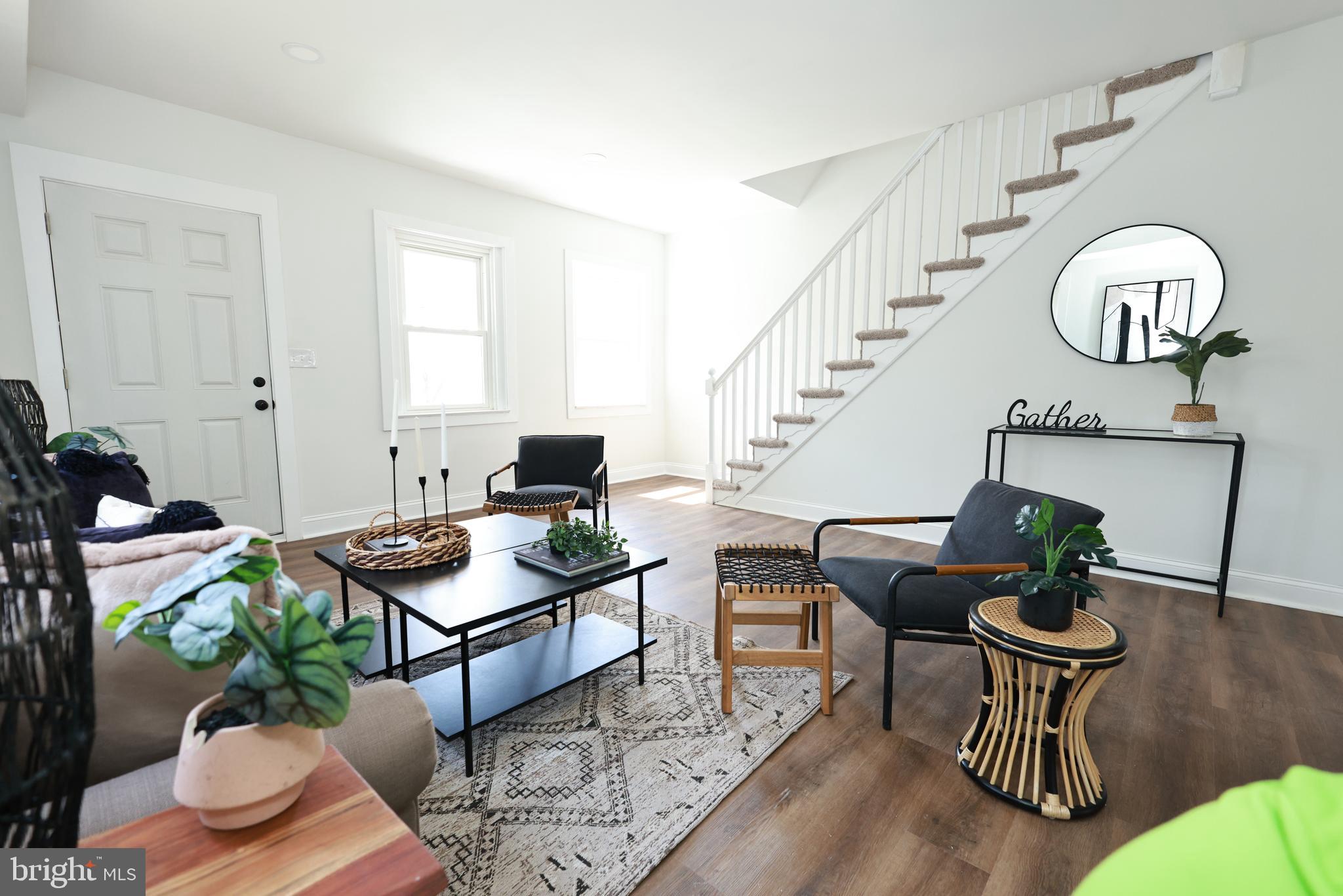 4220 Frederick Avenue Baltimore, MD 21229 - Photo 3 of 24 a living room with furniture and wooden floor