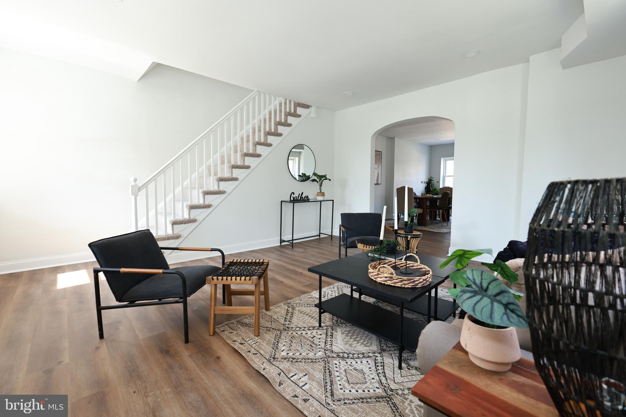 4220 Frederick Avenue Baltimore, MD 21229 - Photo 4 of 24 a living room with furniture and wooden floor