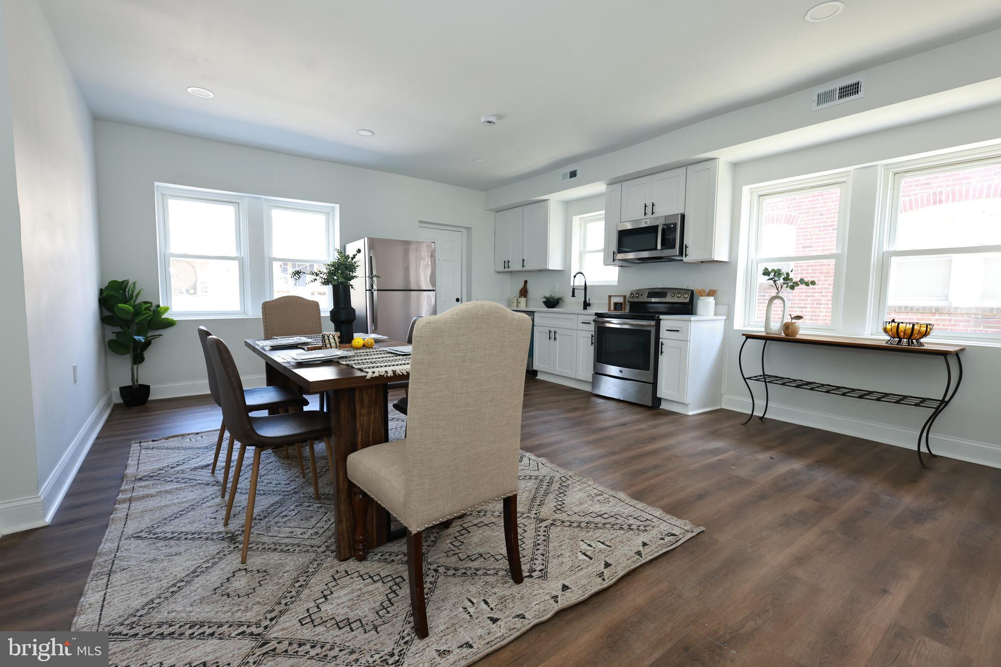 4220 Frederick Avenue Baltimore, MD 21229 - Photo 6 of 24 a living room with furniture and a kitchen