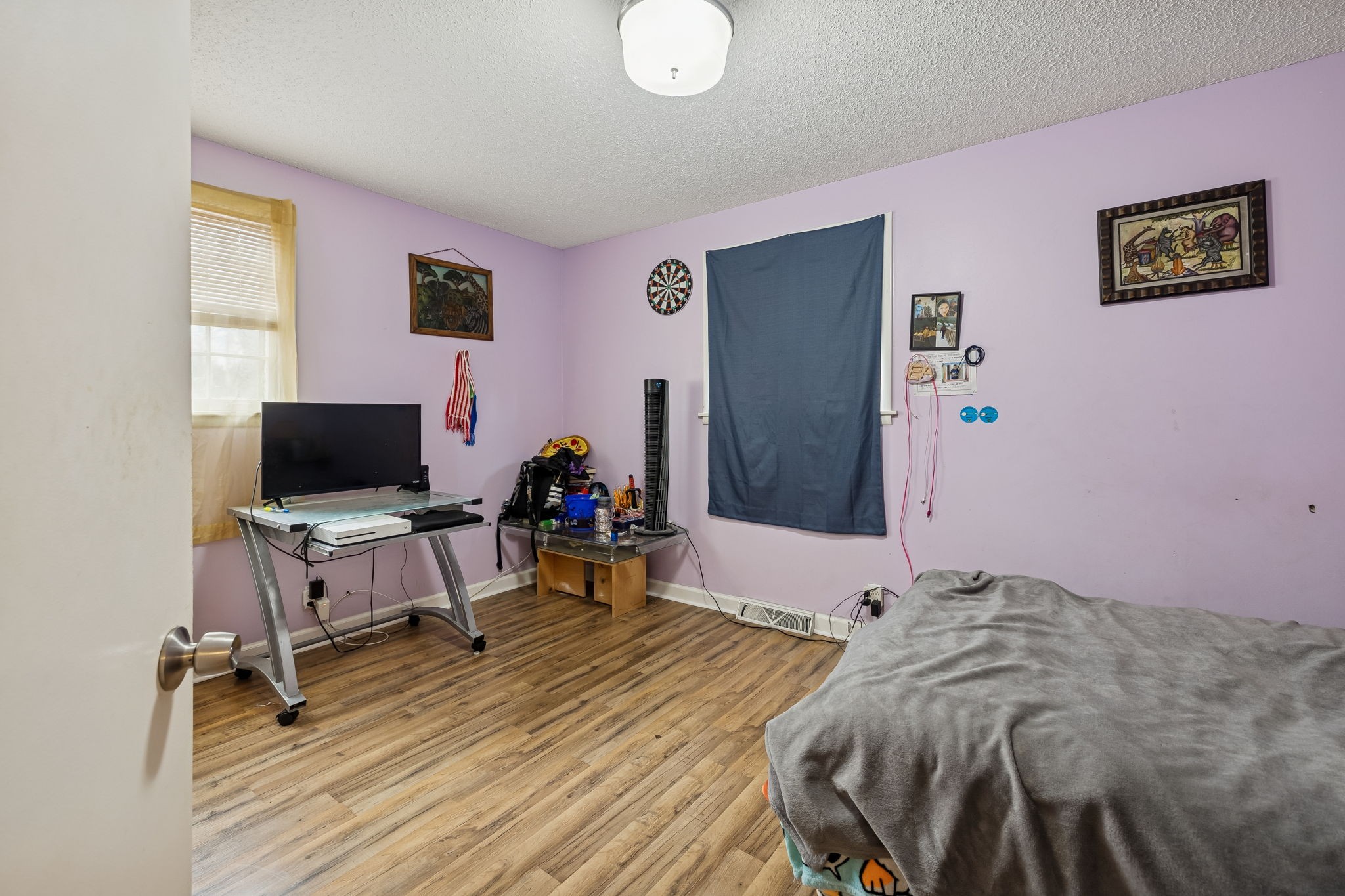 512 Rural Hill Road Nashville, TN 37217 - Photo 11 of 16 a bed room with a bed and a chair