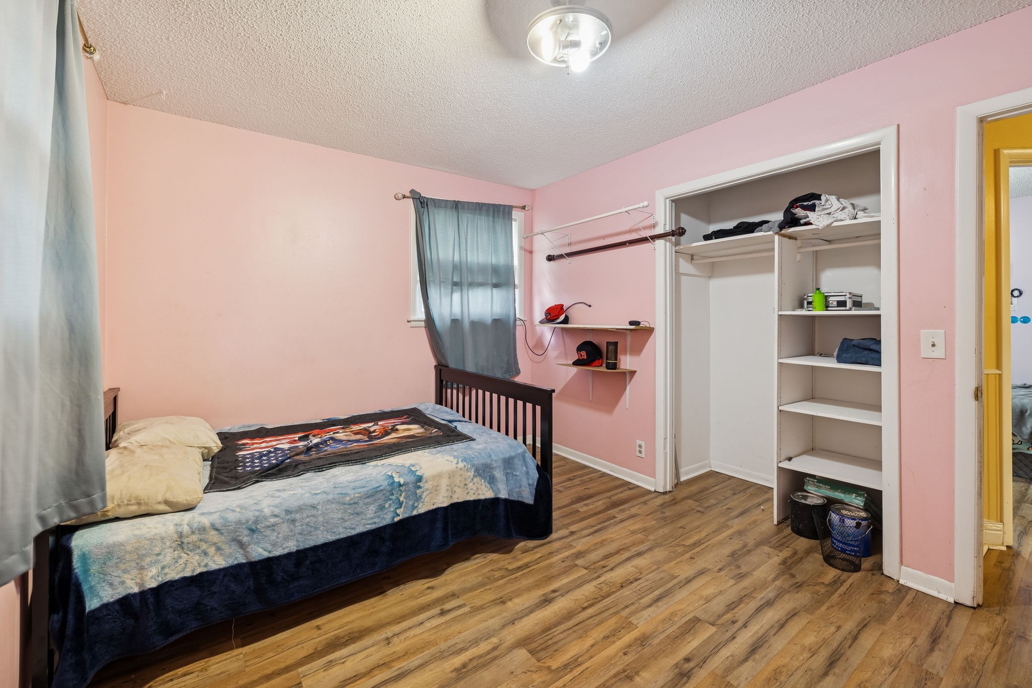 512 Rural Hill Road Nashville, TN 37217 - Photo 14 of 16 a bedroom with a bed and wooden floor