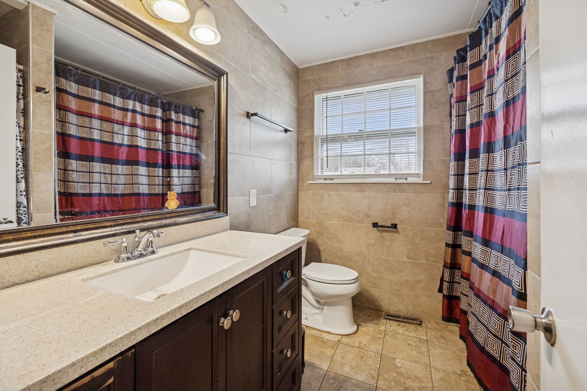 512 Rural Hill Road Nashville, TN 37217 - Photo 10 of 16 a bathroom with a sink toilet and shower