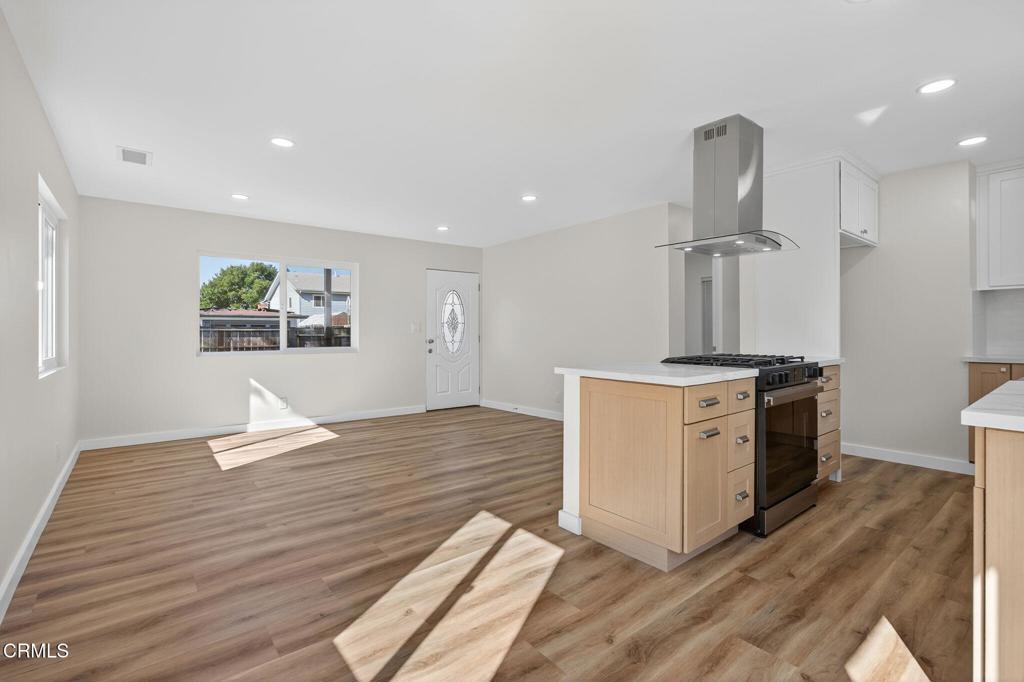 310 Prospect Street Oak View, CA 93022 - Photo 12 of 38 a kitchen with a sink cabinets and wooden floor