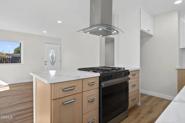 a kitchen with a stove and a table