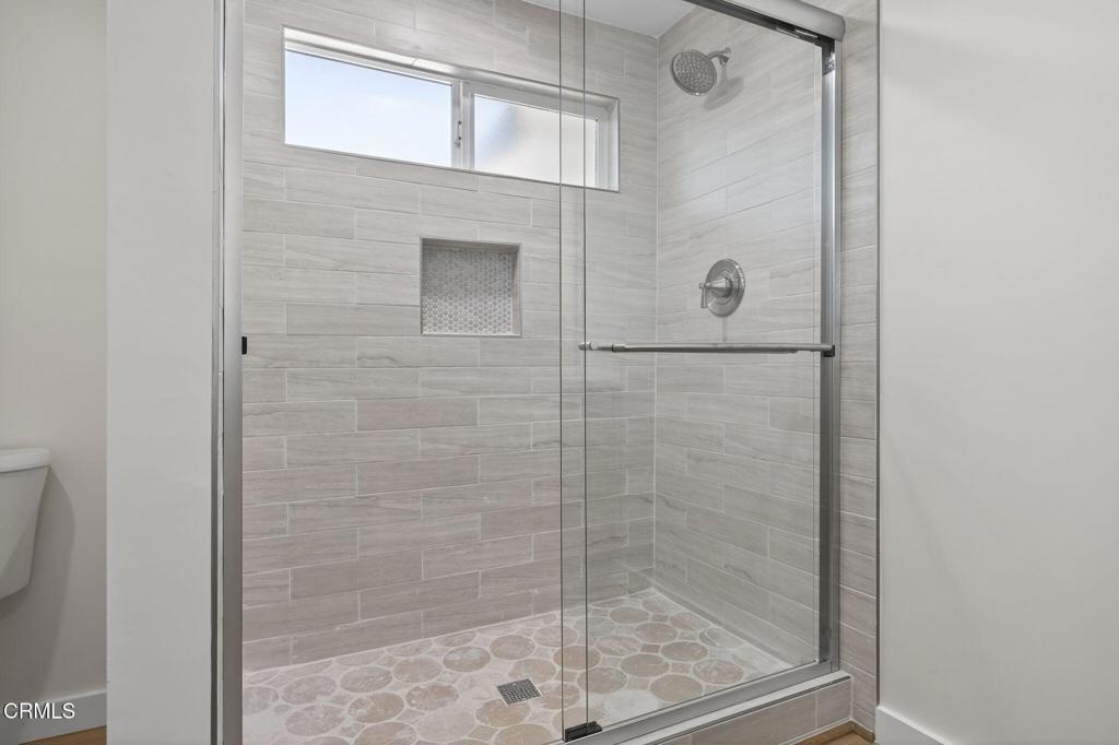 310 Prospect Street Oak View, CA 93022 - Photo 21 of 38 a bathroom with a glass shower door