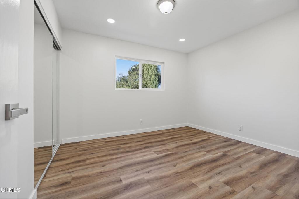 310 Prospect Street Oak View, CA 93022 - Photo 26 of 38 a view of room with wooden floor and window