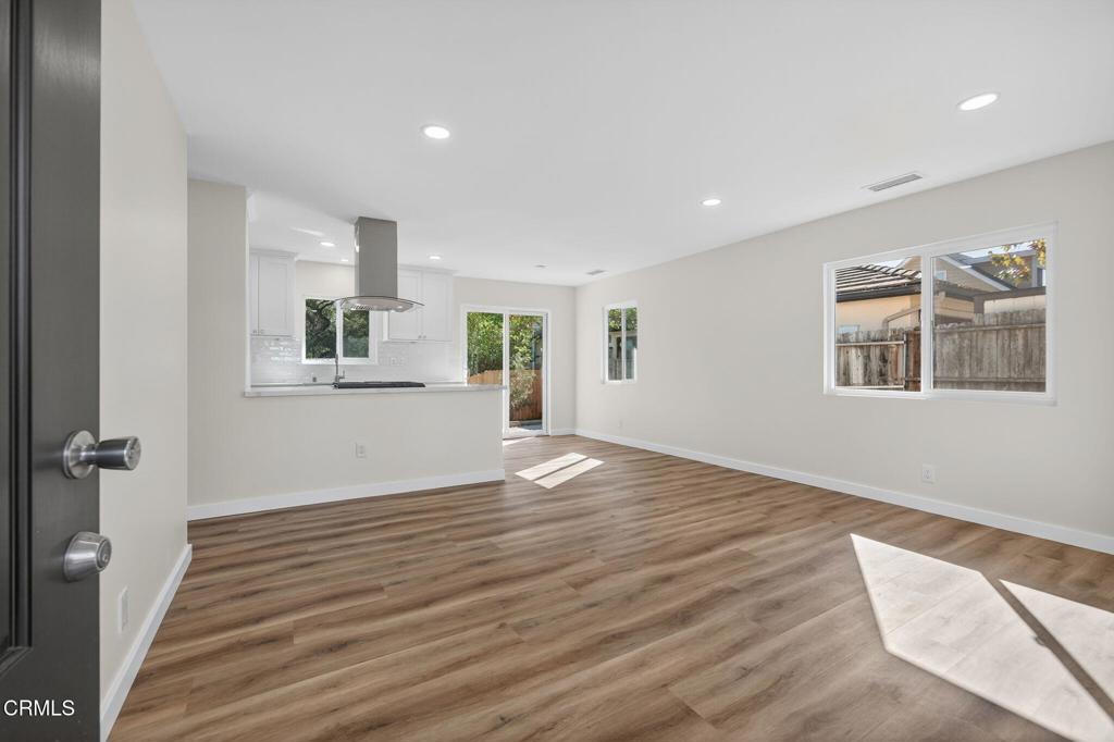 310 Prospect Street Oak View, CA 93022 - Photo 9 of 38 a view of an empty room with wooden floor and a window