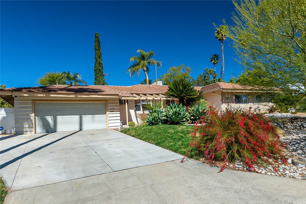 2335 Daventry Road Riverside, CA 92506 - Photo 1 of 1 a view of a house with a yard and potted plants