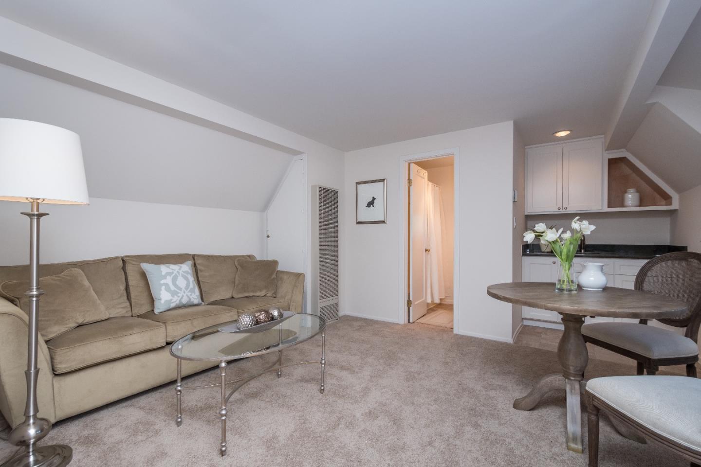 515 Warren Road San Mateo, CA 94402 - Photo 20 of 27 a living room with furniture and a potted plant