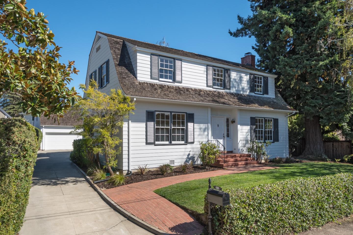 515 Warren Road San Mateo, CA 94402 - Photo 2 of 27 a front view of a house with garden