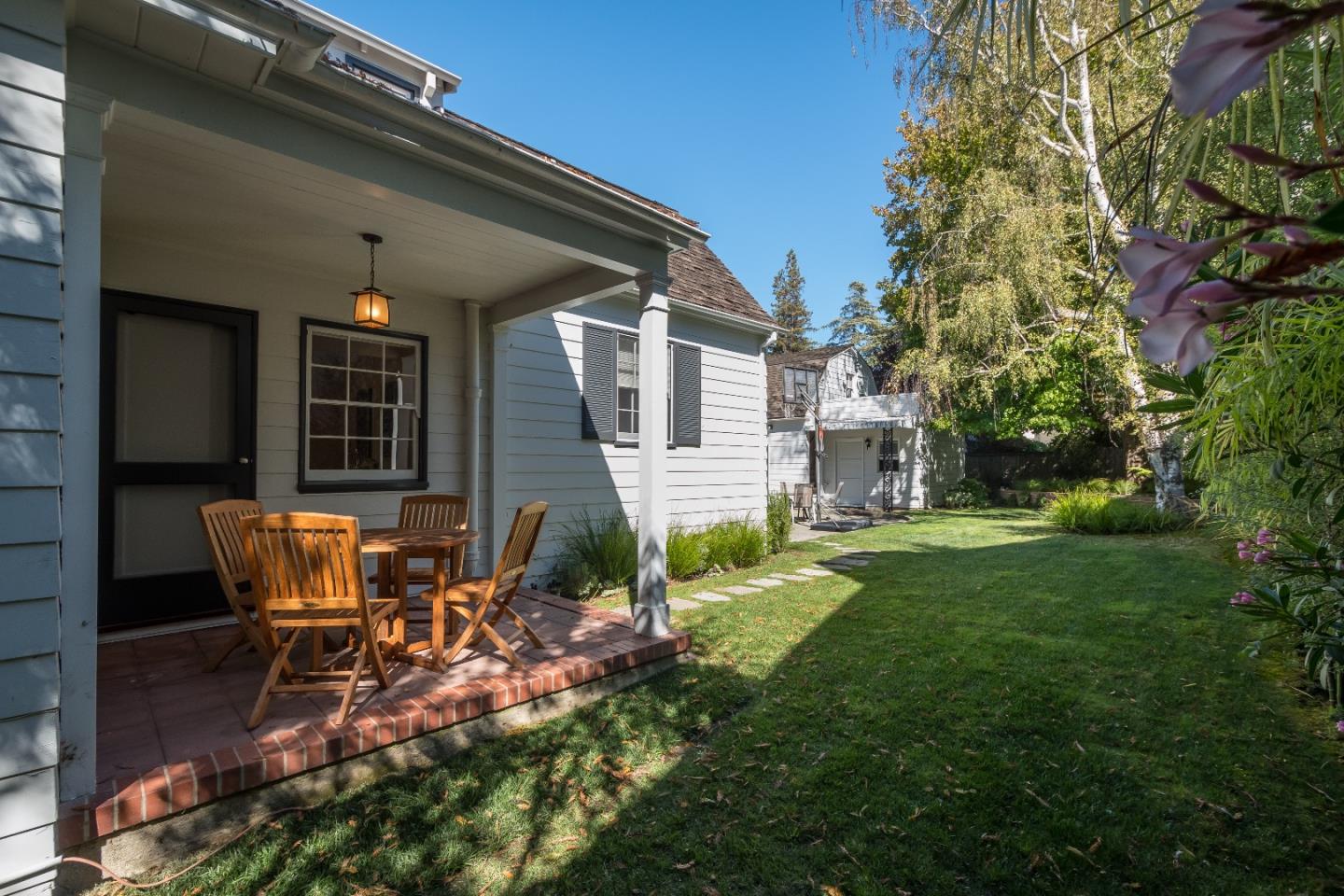 515 Warren Road San Mateo, CA 94402 - Photo 22 of 27 a backyard of a house with table and chairs