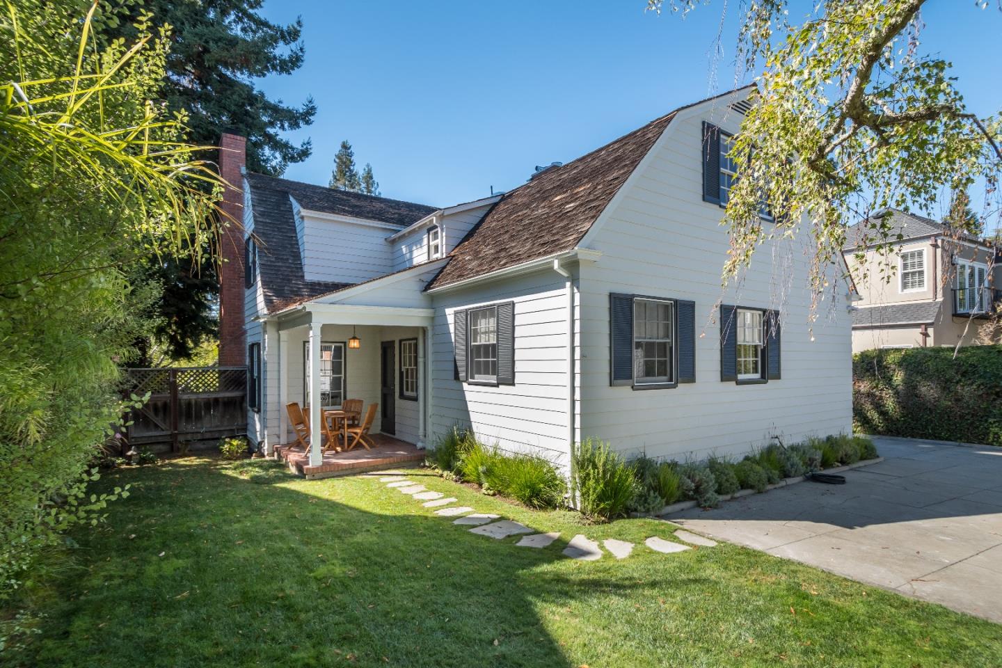 515 Warren Road San Mateo, CA 94402 - Photo 23 of 27 a view of a house with brick walls and a yard with plants