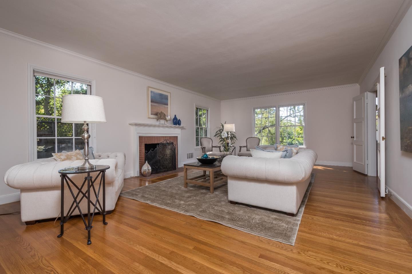 515 Warren Road San Mateo, CA 94402 - Photo 5 of 27 a living room with furniture and a fireplace