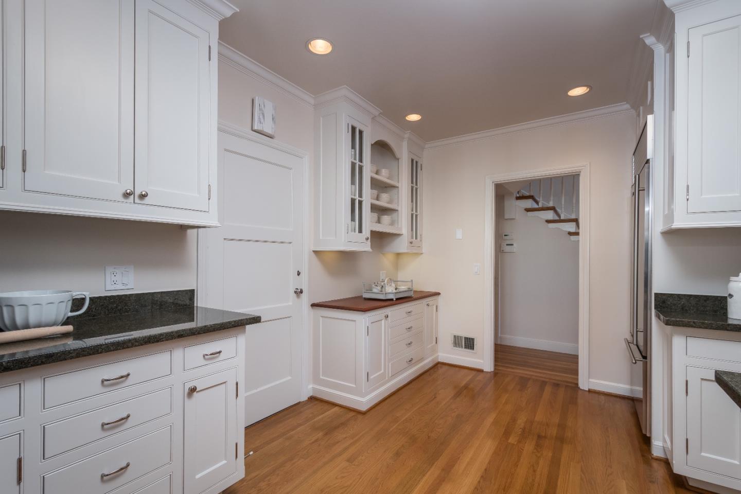 515 Warren Road San Mateo, CA 94402 - Photo 9 of 27 a kitchen with stainless steel appliances granite countertop a stove and a refrigerator