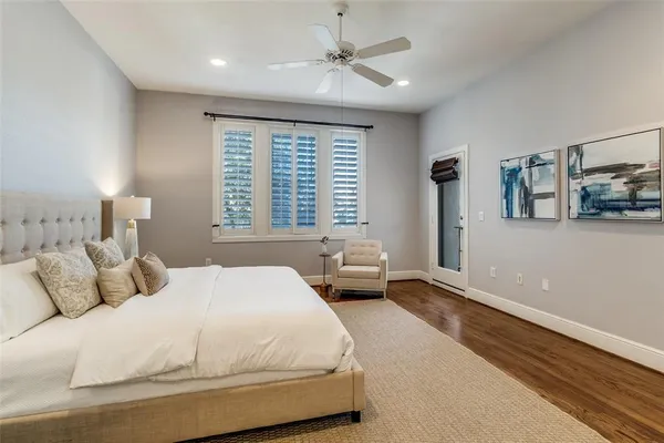 a bedroom with a bed couch and a window
