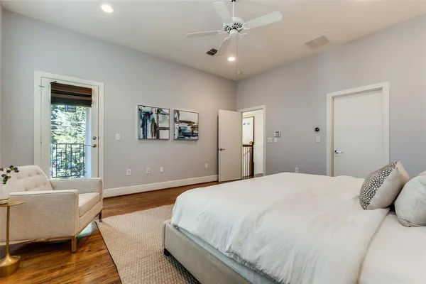 a bedroom with a bed couch and window