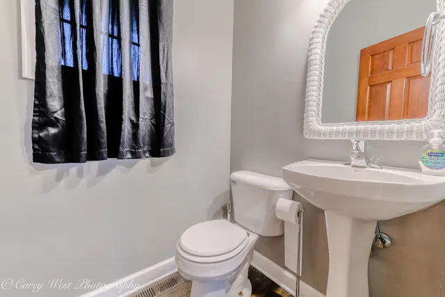 an empty room with closet and fan