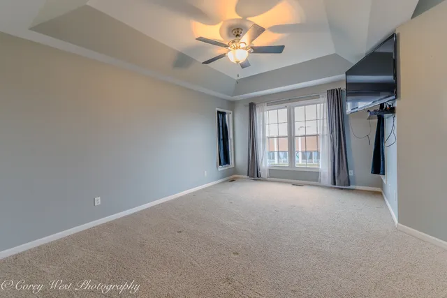 a view of a hallway with wooden shelves