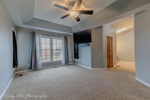 a bathroom with a tub and a window