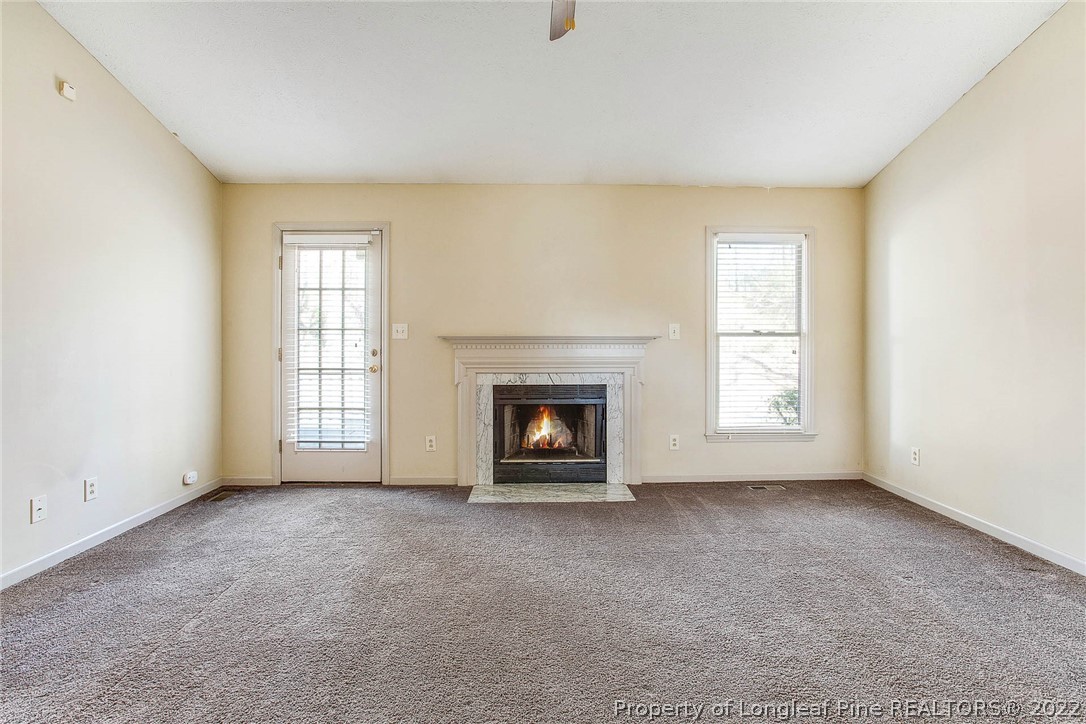2608 Laurel Lakes Road Fayetteville, NC 28301 - Photo 16 of 32 an empty room with a window and fireplace
