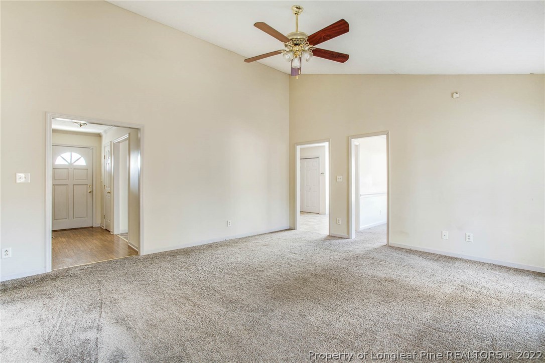 2608 Laurel Lakes Road Fayetteville, NC 28301 - Photo 18 of 32 an empty room with a empty space and a ceiling fan