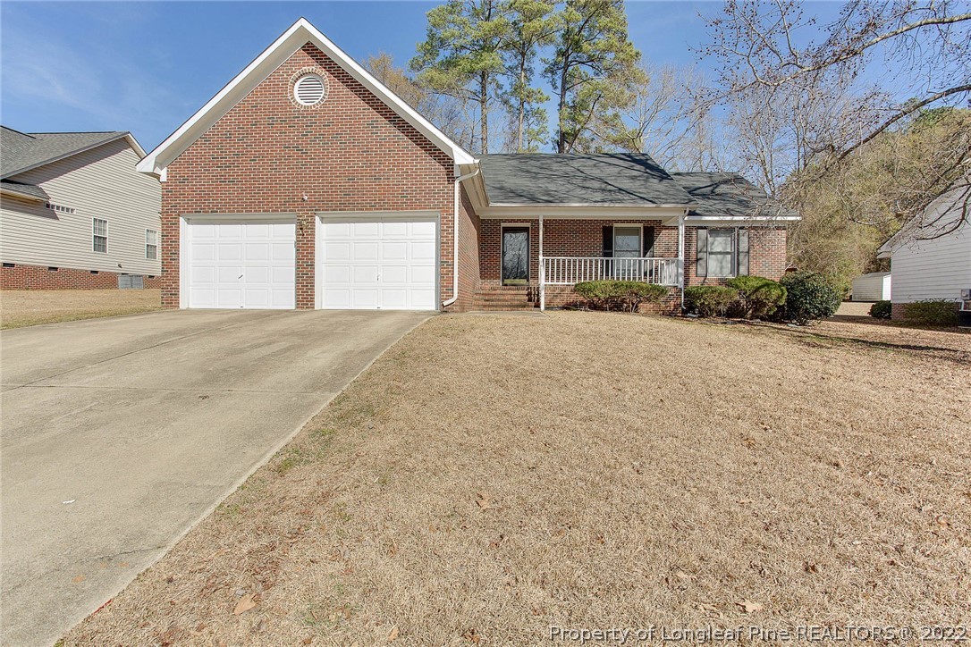 2608 Laurel Lakes Road Fayetteville, NC 28301 - Photo 2 of 32 front view of a house with a yard