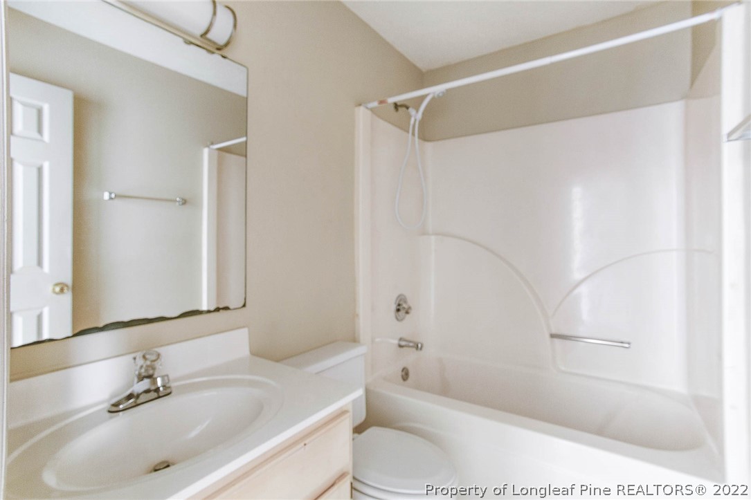 2608 Laurel Lakes Road Fayetteville, NC 28301 - Photo 21 of 32 a bathroom with a sink toilet and shower