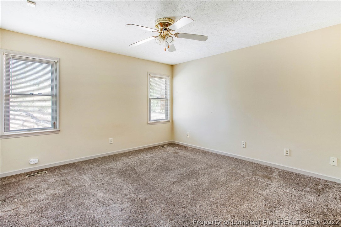 2608 Laurel Lakes Road Fayetteville, NC 28301 - Photo 24 of 32 wooden floor in an empty room with a window