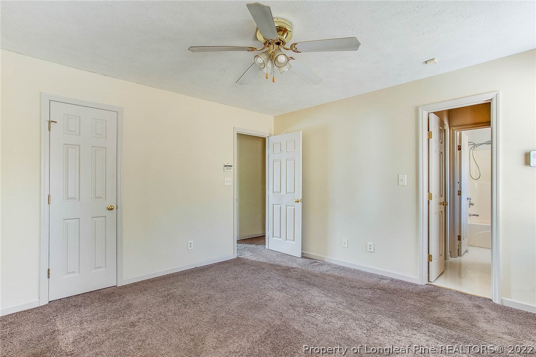 2608 Laurel Lakes Road Fayetteville, NC 28301 - Photo 25 of 32 a view of a room with a ceiling fan