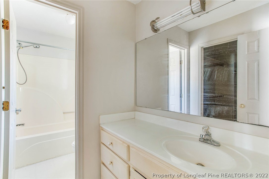 2608 Laurel Lakes Road Fayetteville, NC 28301 - Photo 26 of 32 a bathroom with a bathtub and a sink