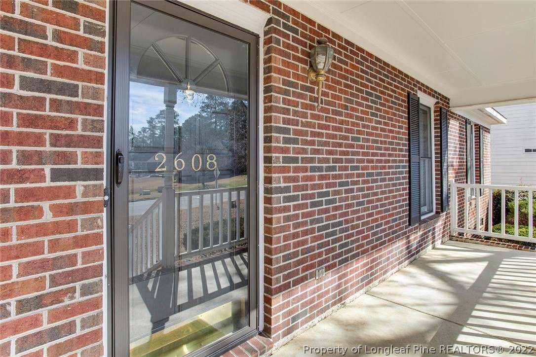 2608 Laurel Lakes Road Fayetteville, NC 28301 - Photo 5 of 32 a view of a brick wall with a black and white comforter