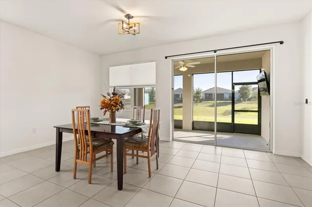 a view of a room dining table and chairs